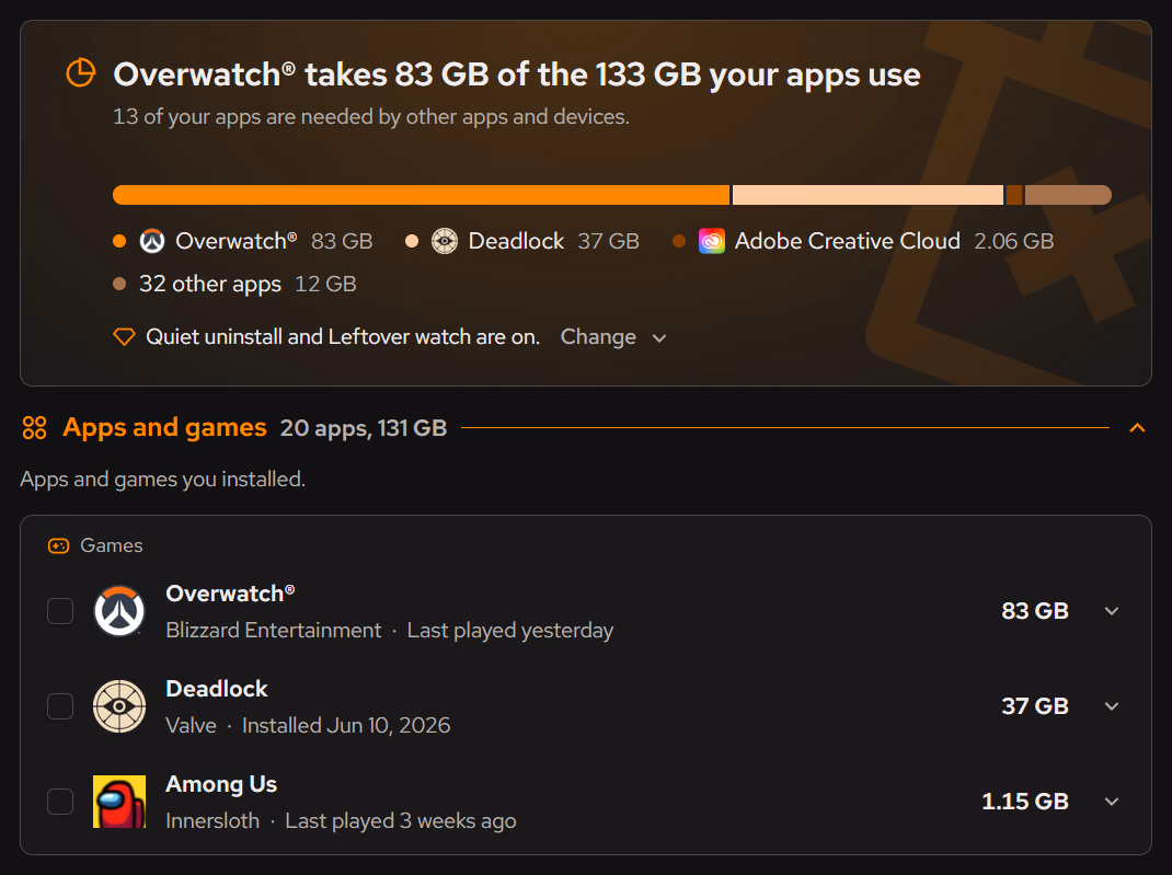 The Desktop apps summary card. Overwatch takes 83 GB of the 133 GB your apps use, and 13 of your apps are needed by other apps and devices. A bar splits the space between Overwatch 83 GB, Deadlock 37 GB, Adobe Creative Cloud 2.06 GB and 32 other apps 12 GB. A note reads Quiet uninstall and Leftover watch are on. Below, the Apps and games section lists Overwatch, Deadlock and Among Us.